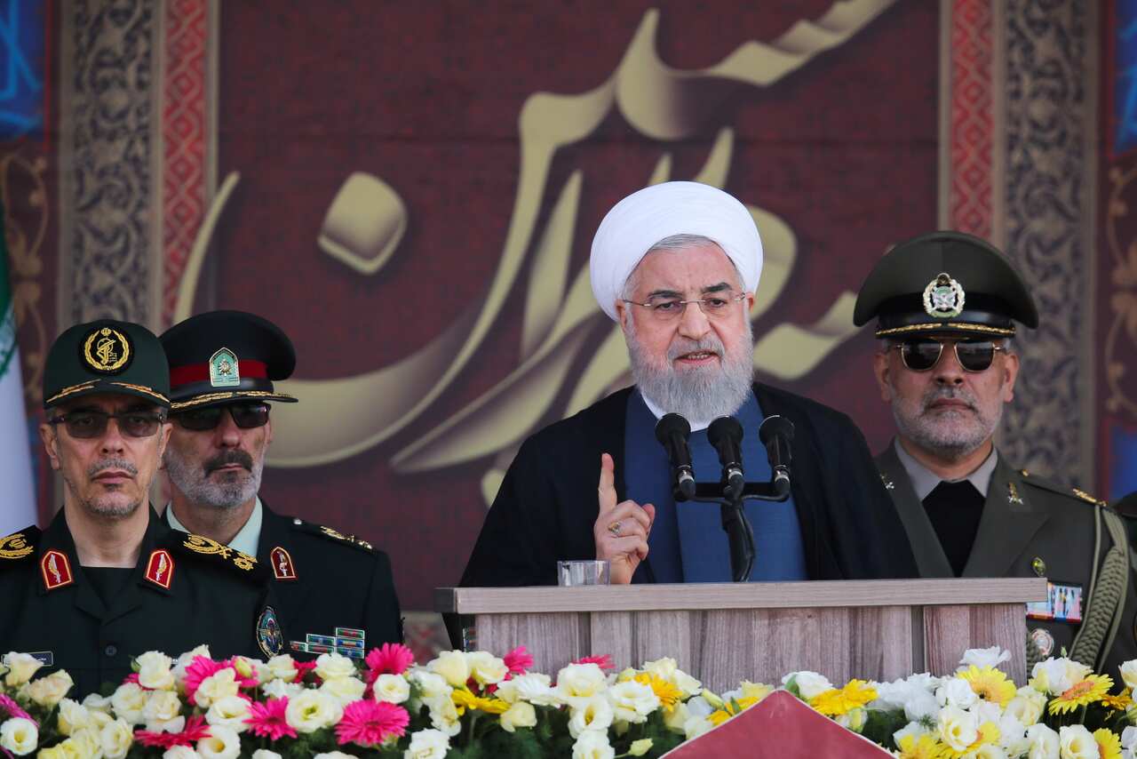Iranian President Hassan Rouhani delivers his speech during the annual military parade marking the Iraqi invasion in 1980.