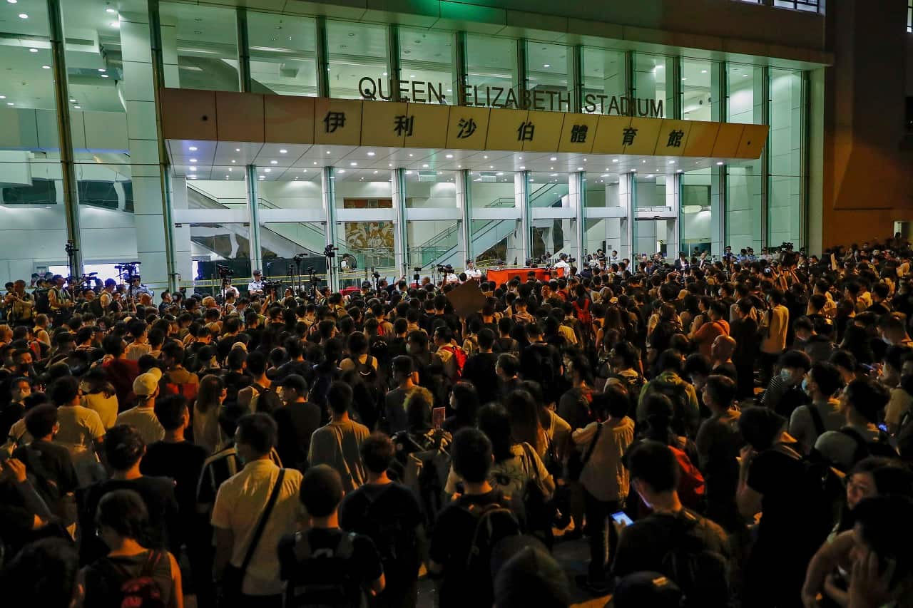 Protesters gather outside the Queen Elizabeth Stadium in Hong Kong on Thursday.