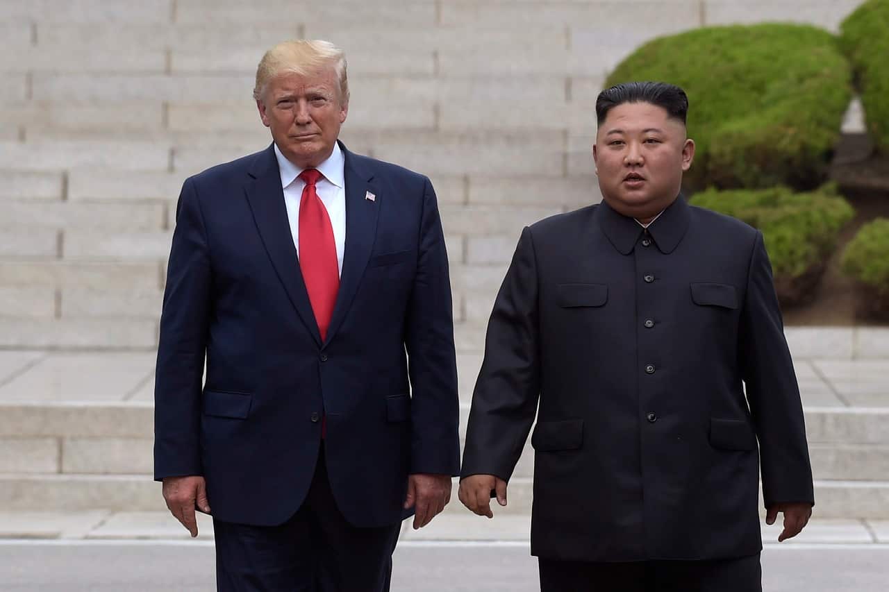 Donald Trump meets Kim Jong-un earlier this year.