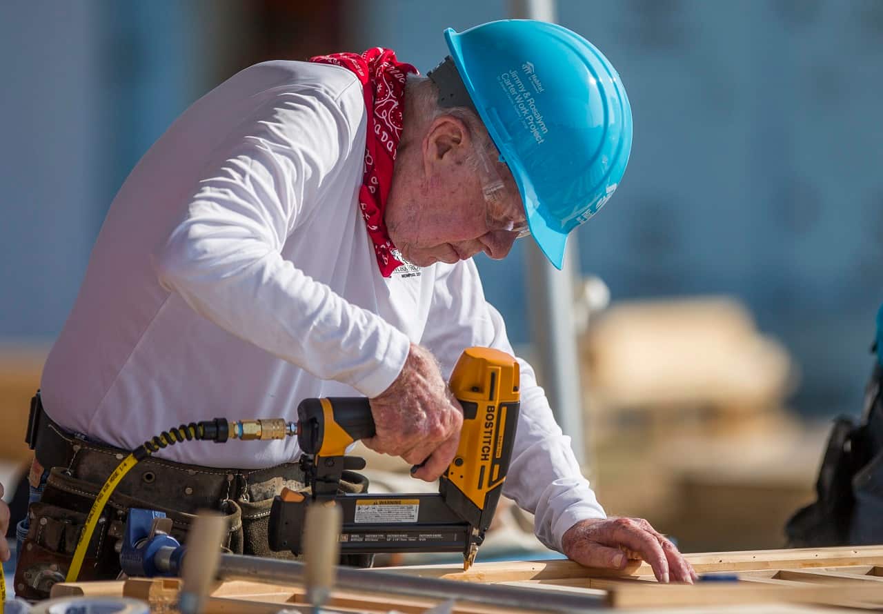 Jimmy Carter works on a Habitat for Humanity project. 