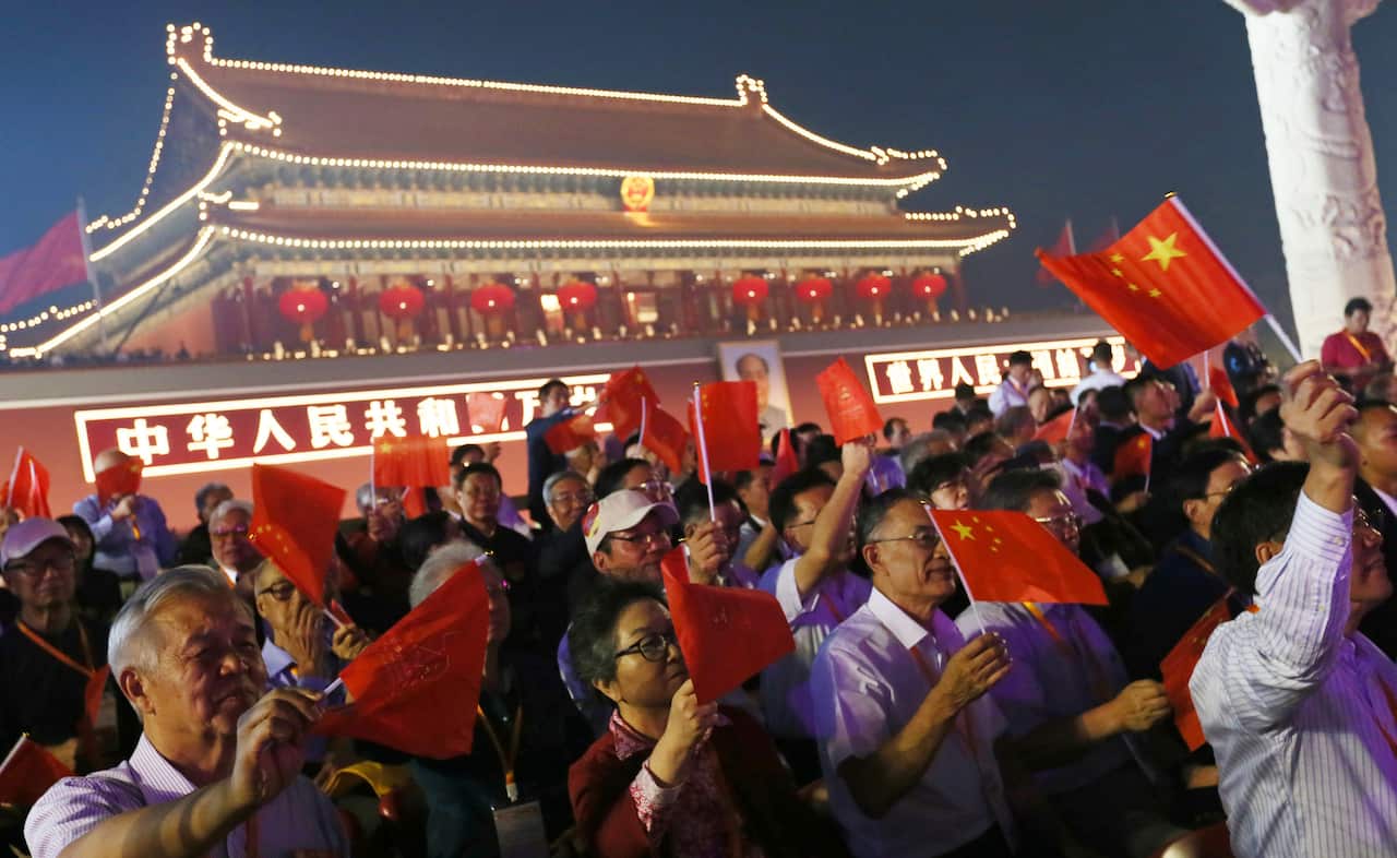 A night show to celebrate the 70th anniversary of the founding of a nation is held at the Tiananmen Square in Beijing, China on October 1, 2019. New weapons were unveiled at the largest military parade ever. ( The Yomiuri Shimbun via AP Images )