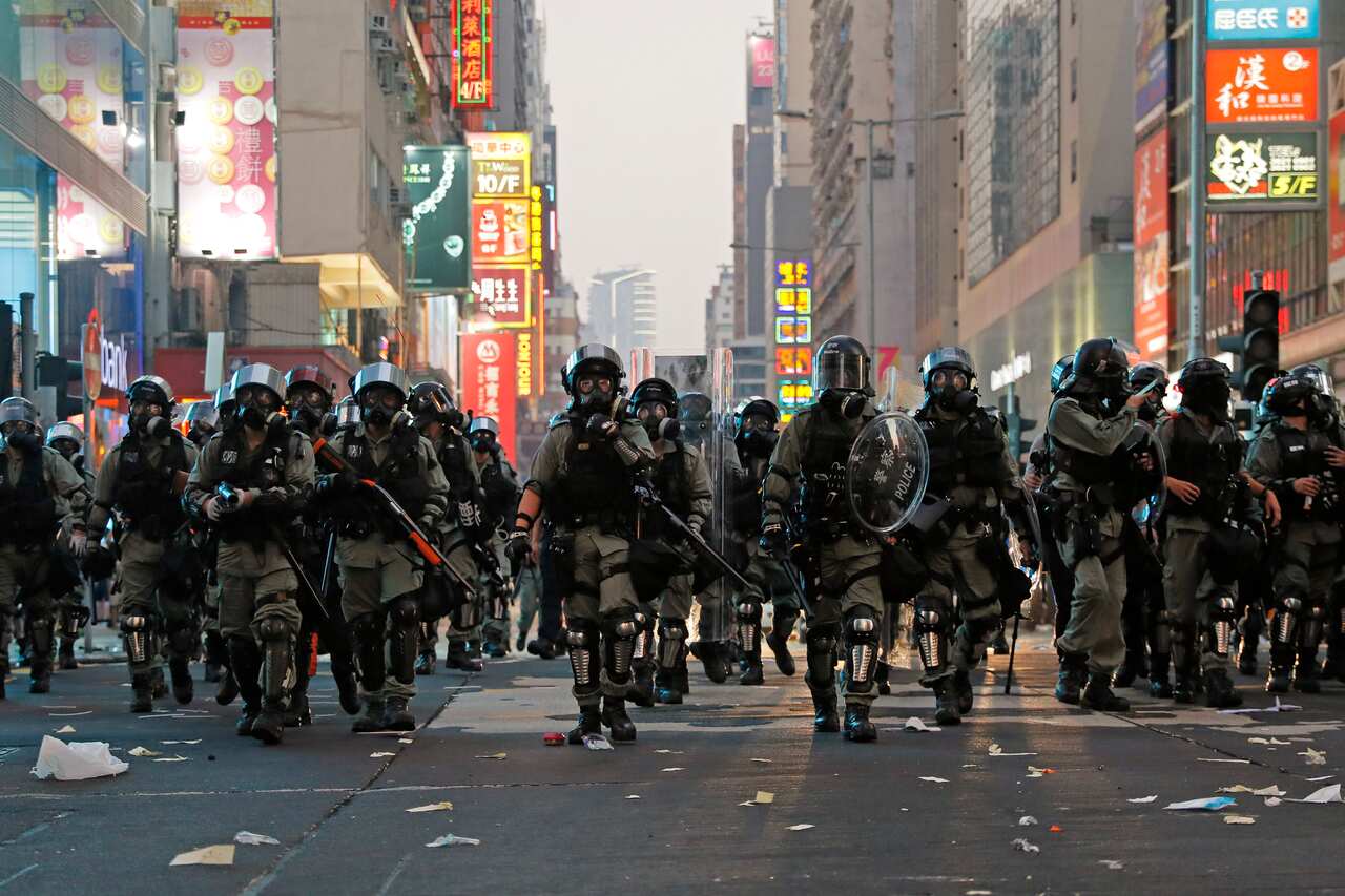 Riot police move towards protesters in Hong Kong