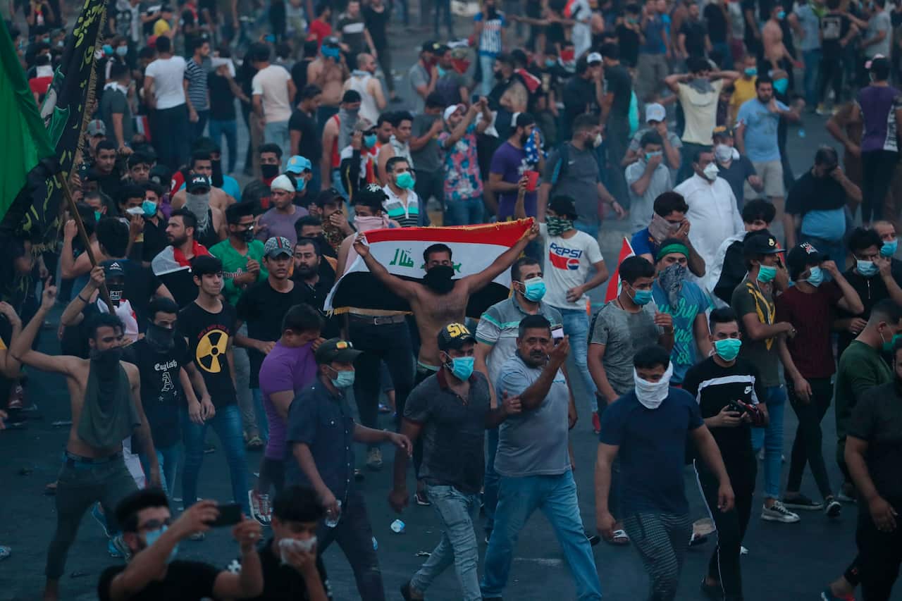 Anti-government protesters chant slogans during a demonstration in Baghdad.