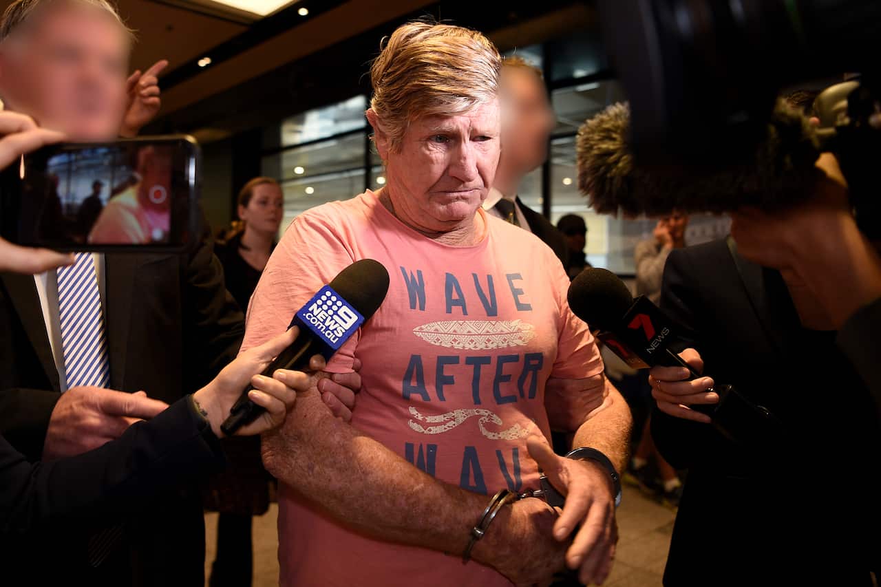 John Bowie is seen arriving via police escort at Sydney Domestic Airport in Sydney.