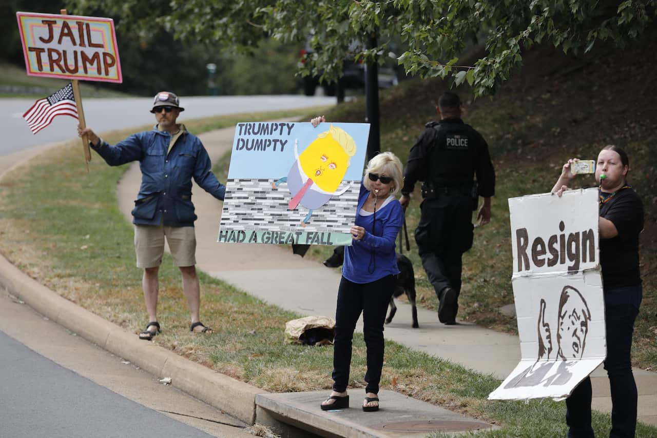 U.S. President Donald Trump's motorcade passes by protestors outside Trump National Golf Club in Sterling, Virginia on October 5, 2019. Photo by Yuri Gripas/ABACAPRESS.COM.