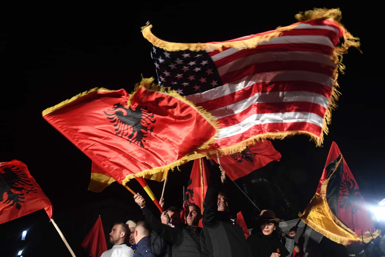 Supporters of Albin Kurti, founder of the opposition party Vetevendosje celebrate after the early exit polls.