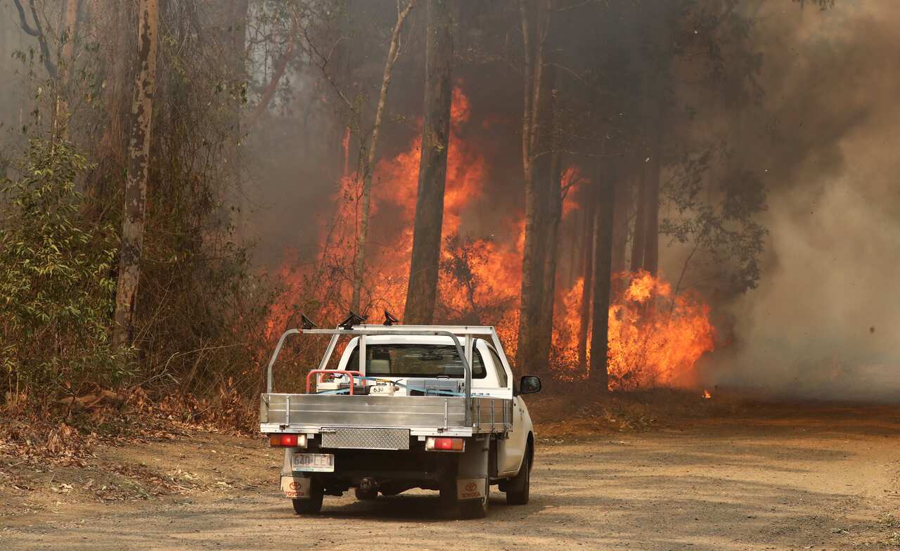 Bushfires rage near a road at Busbys Flat in northern NSW.
