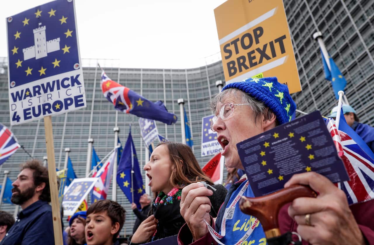 Anti-Brexit demonstrators stand in front of the European Commission.