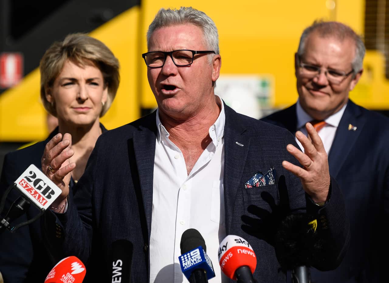 Scott Cam speaking to media.