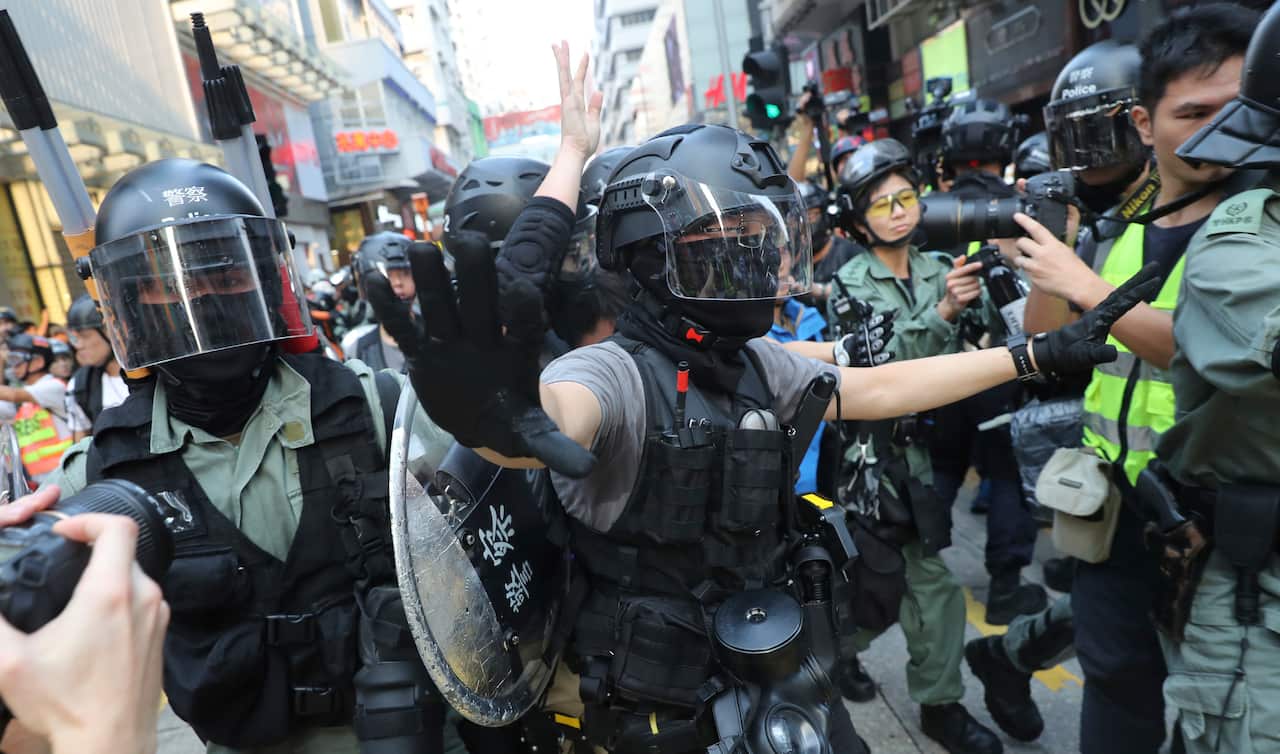 Police officers threaten protesters during a demonstration in Hong Kong on Oct. 13, 2019.( The Yomiuri Shimbun via AP Images )
