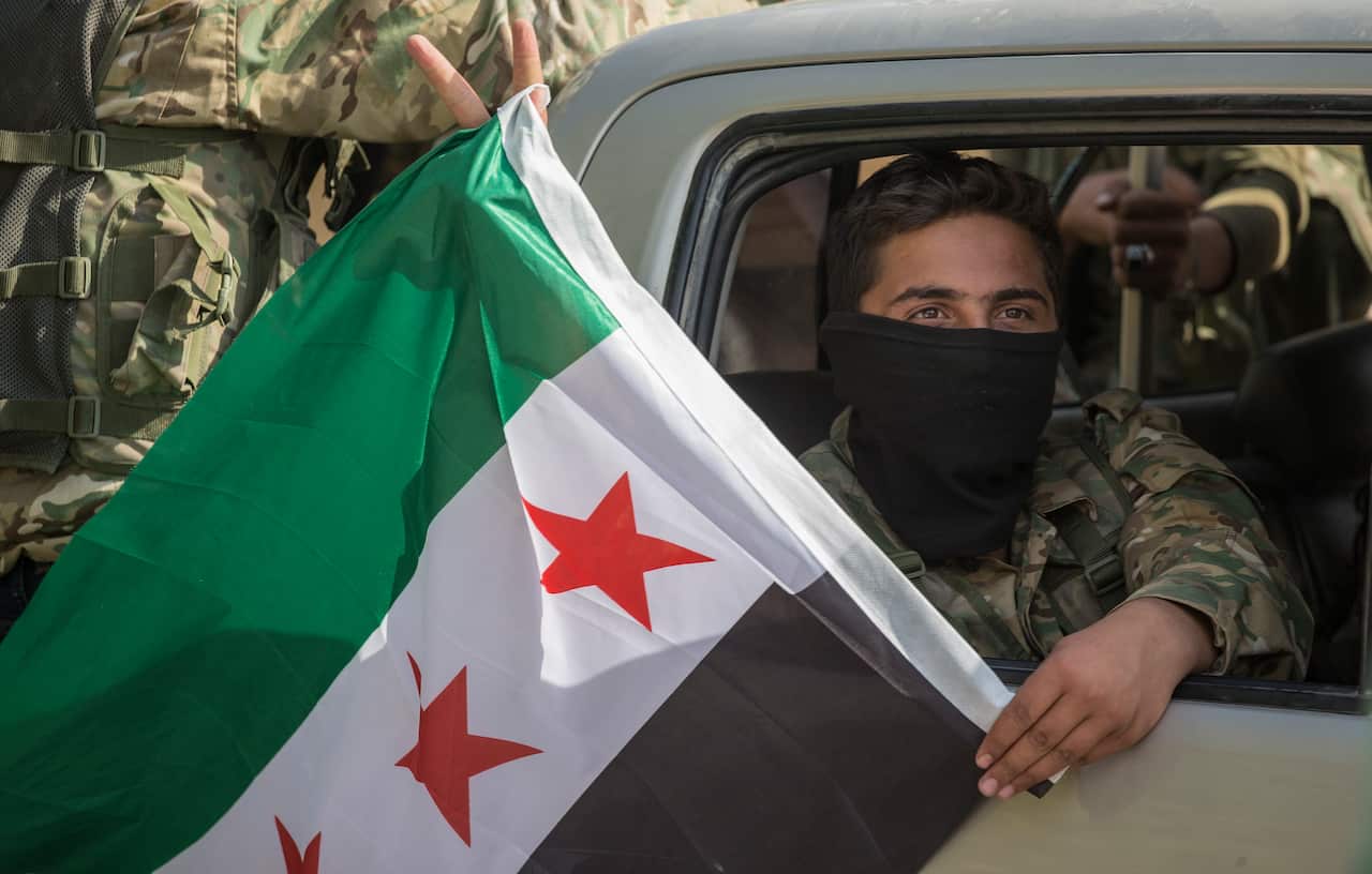 Turkish-backed Syrian fighters move on the way to Northern Syria for a military operation in Kurdish areas near the Syrian border.