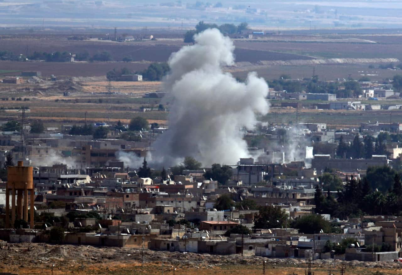 Smoke and dust billows from targets in Ras al-Ayn, Syria, caused by bombardment by Turkish forces, Tuesday, Oct. 15, 2019. 