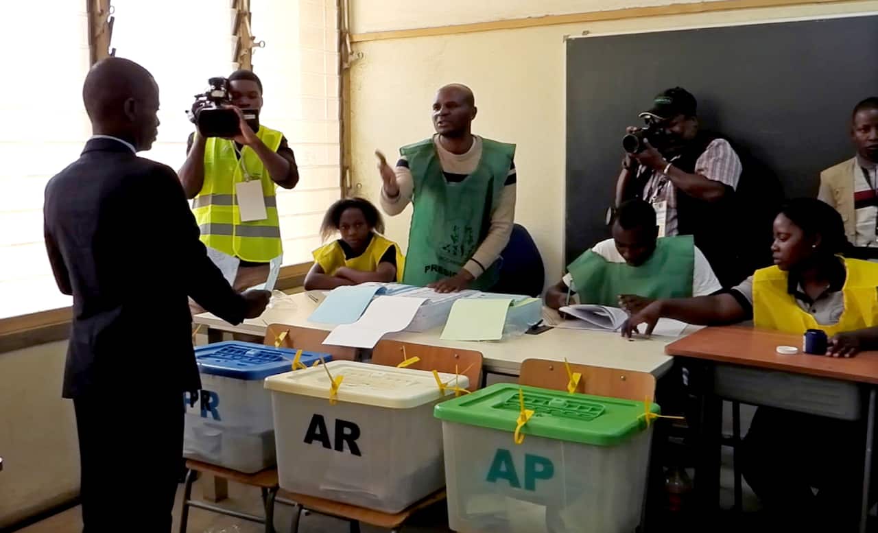 Mario Albino, president of the United Movement for the Integral Salvation (AMUSI), votes at a polling station in Nampula city, Nampula province in Mozambique.