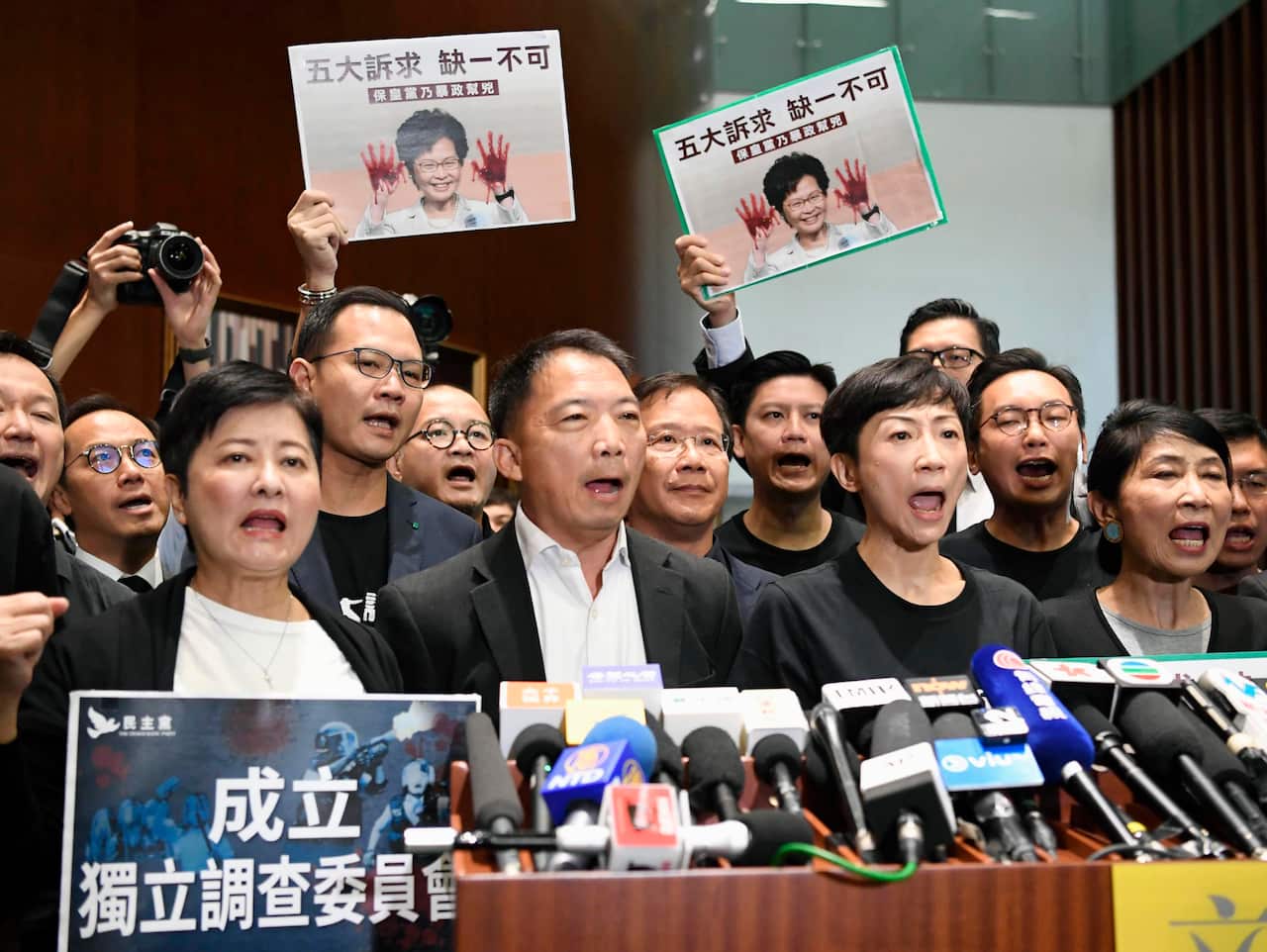 Pro-democracy politicians stage a demonstration at the Legislative Council in Hong Kong.