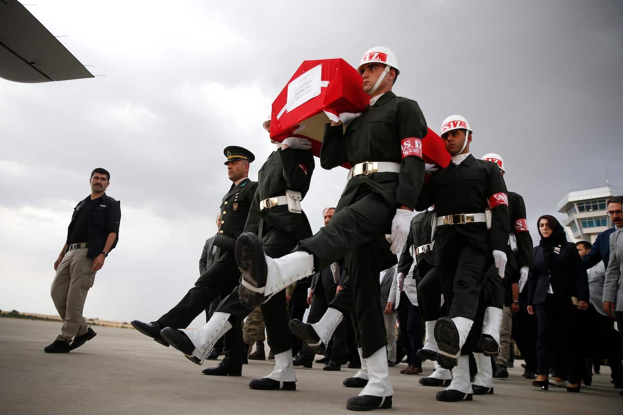 Turkish soldiers carry the Turkish flag-draped coffin of soldier Sefa Findik, killed in action in Syria earlier in the day.