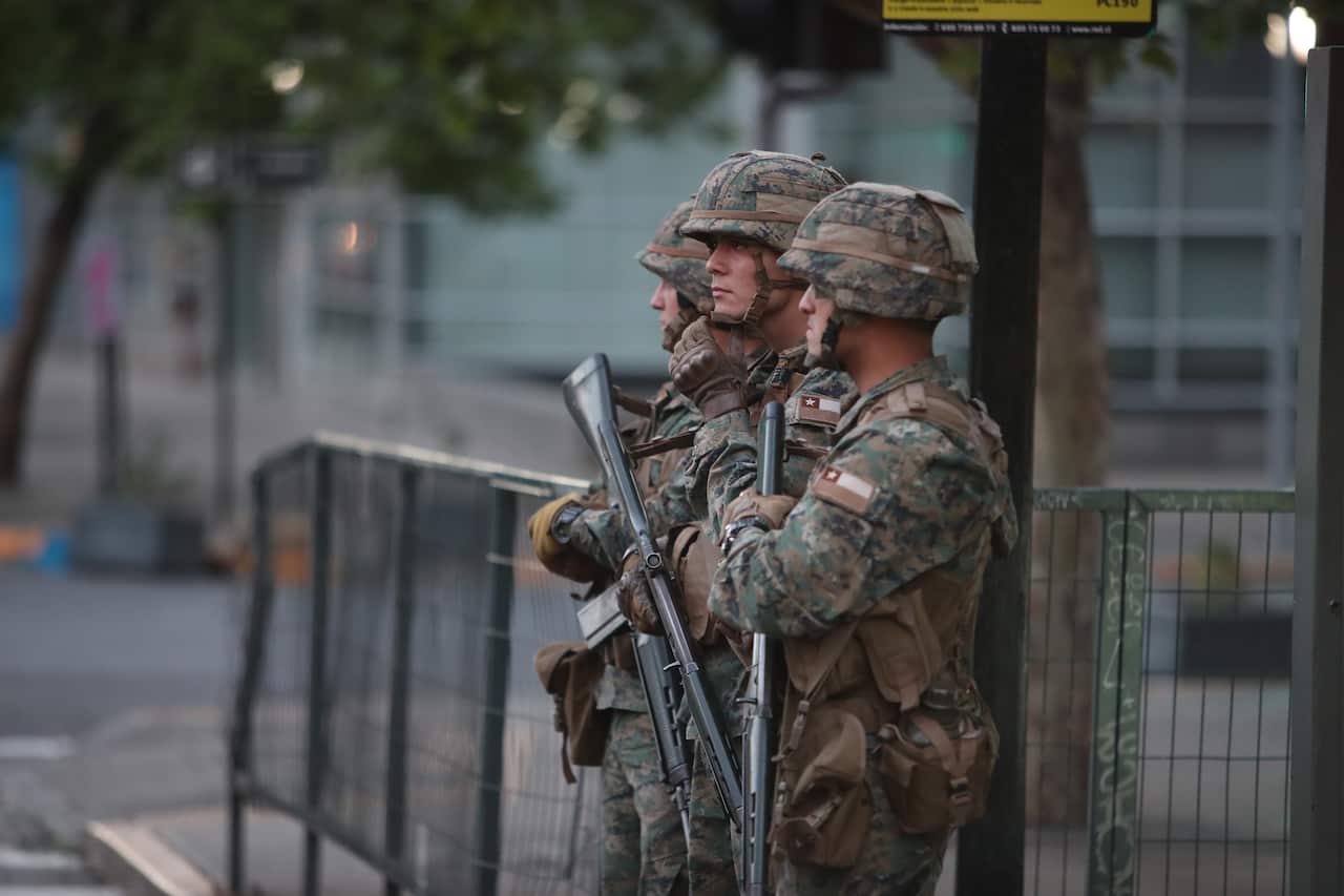 Chile military personnel stand guard in Santiago. 