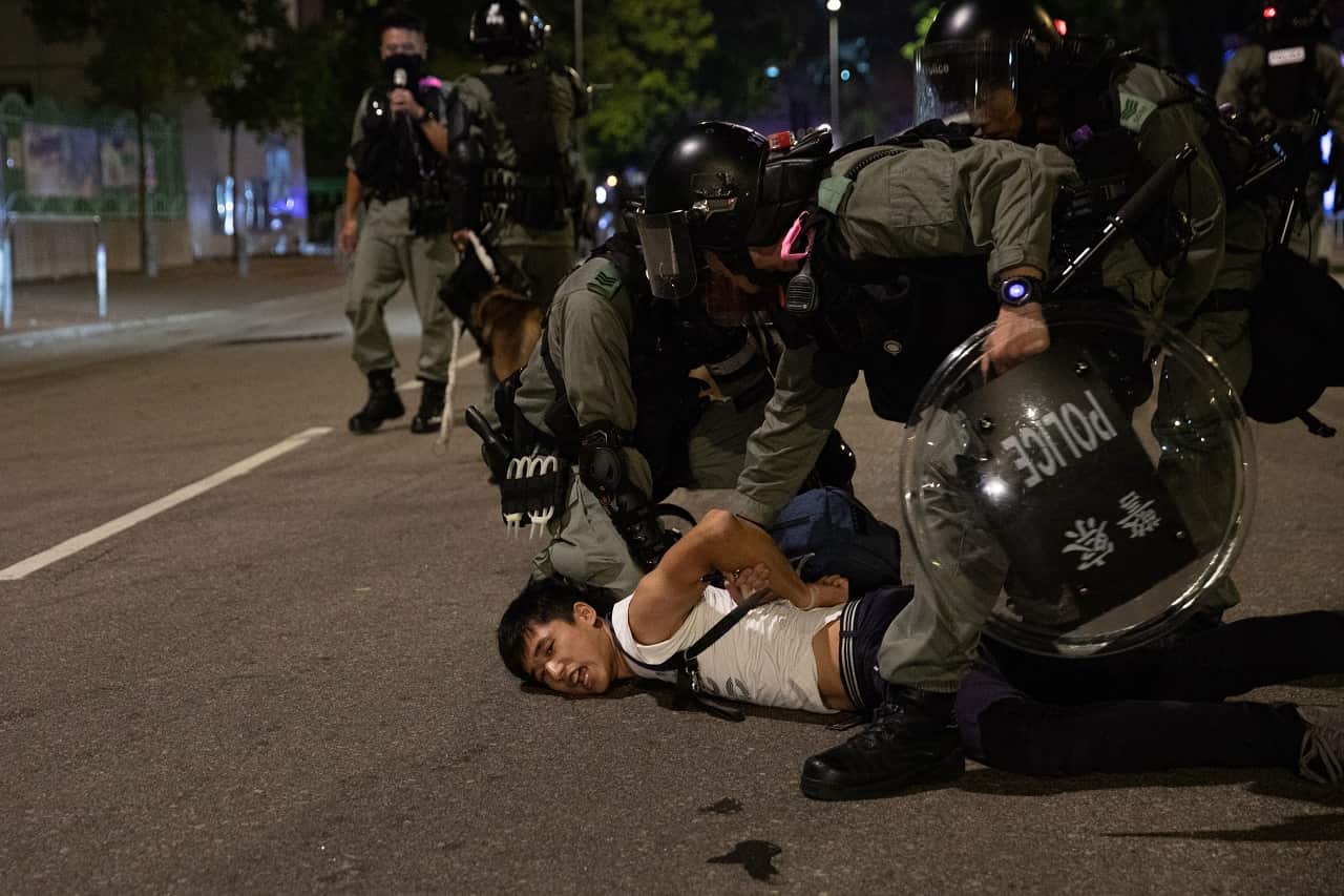 Hong Kong Police detain a protester last week.