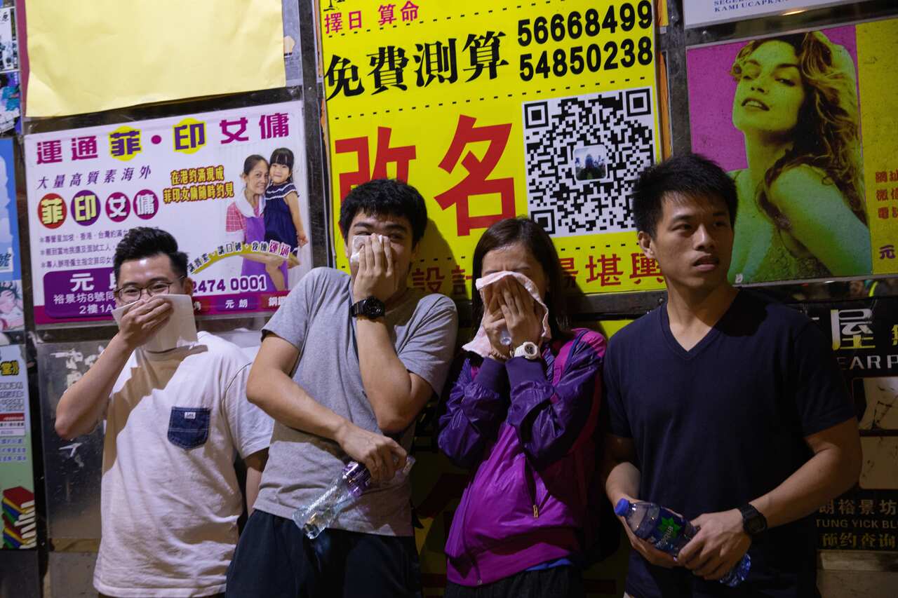 A group of men dressed in white and armed with metal poles and bats, stormed a train station and attacked commuters in Yuen Long last year.
