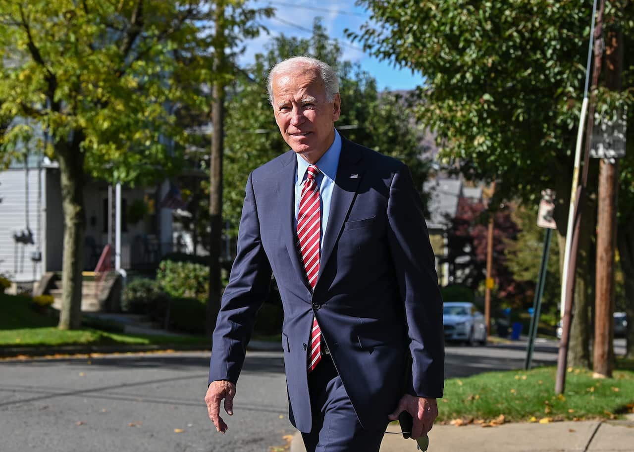 Former U.S. Vice President Joe Biden walks the streets of his childhood home in Scranton Pa., after speaking at the Scranton Cultural Center on Wednesday, Oct. 23, 2019. (Jason Farmer/The Times-Tribune via AP)