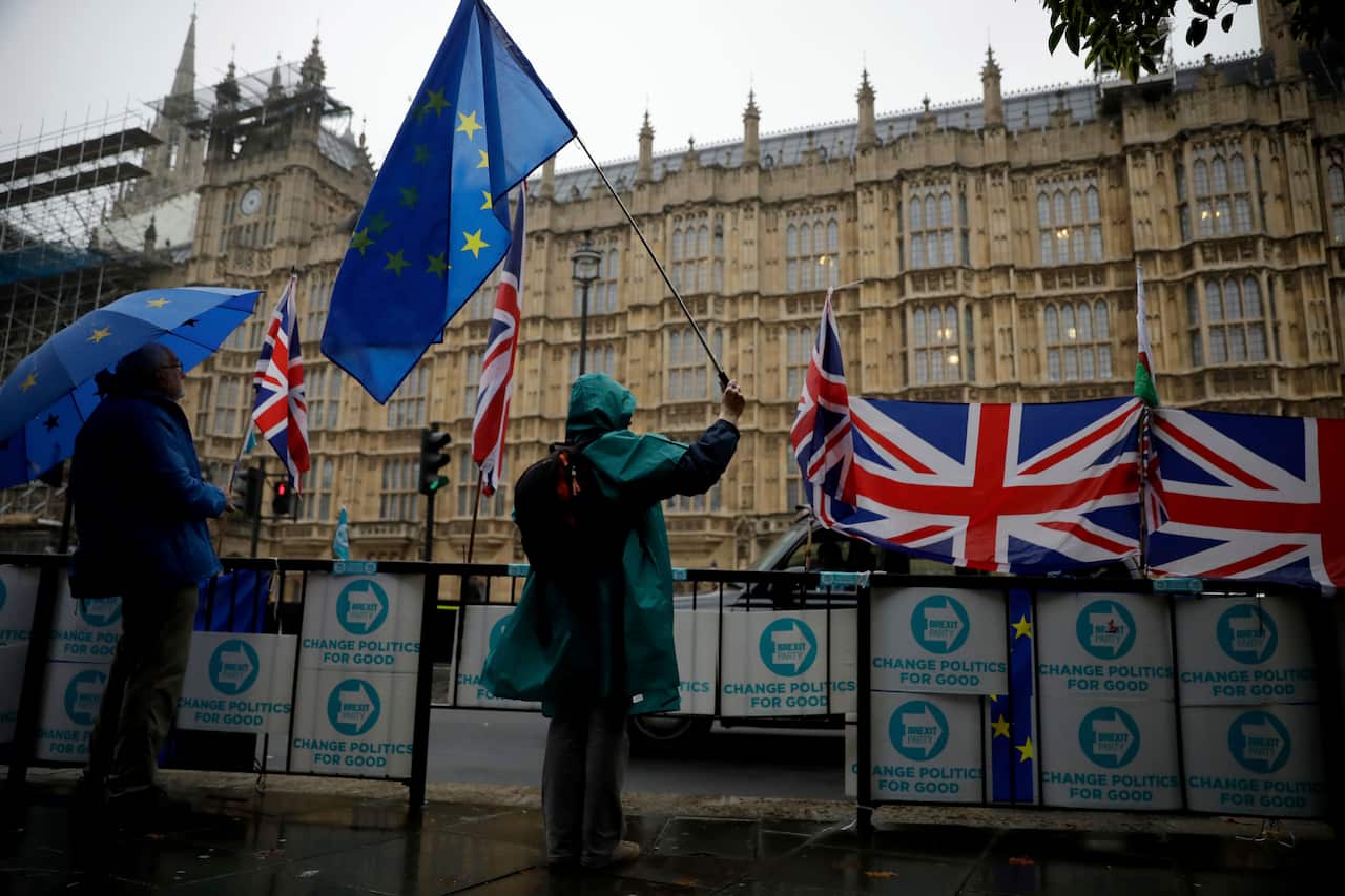 Anti-Brexit remain in the European Union supporters protest outside the Houses of Parliament in London.