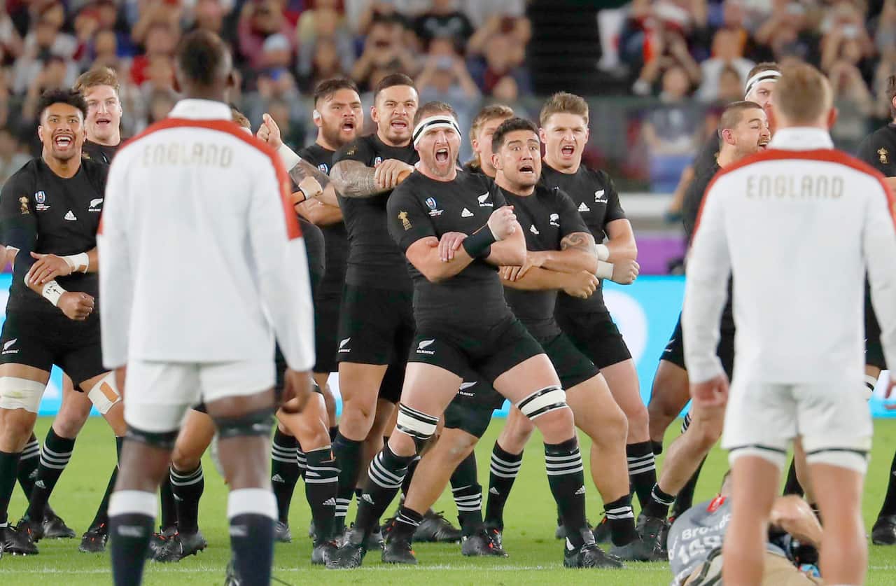 England players (front) watch the New Zealand squad performing the haka prior to a Rugby World Cup semifinal on Oct. 26, 2019, in Yokohama, near Tokyo. (Kyodo via AP Images) ==Kyodo