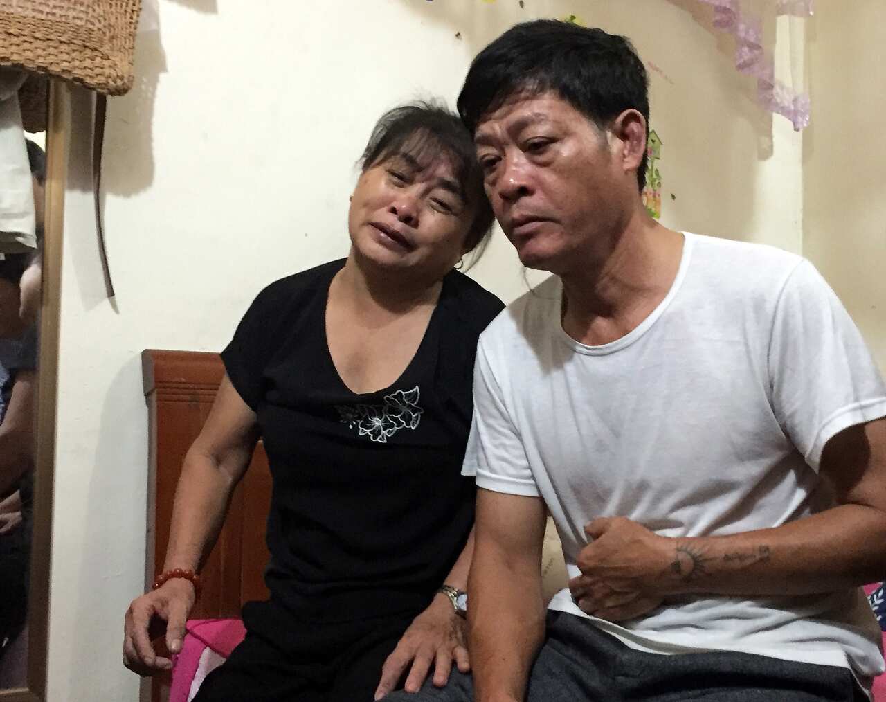 Parents of Pham Thi Tra My, who is believed to be among the 39 people found dead in the truck
