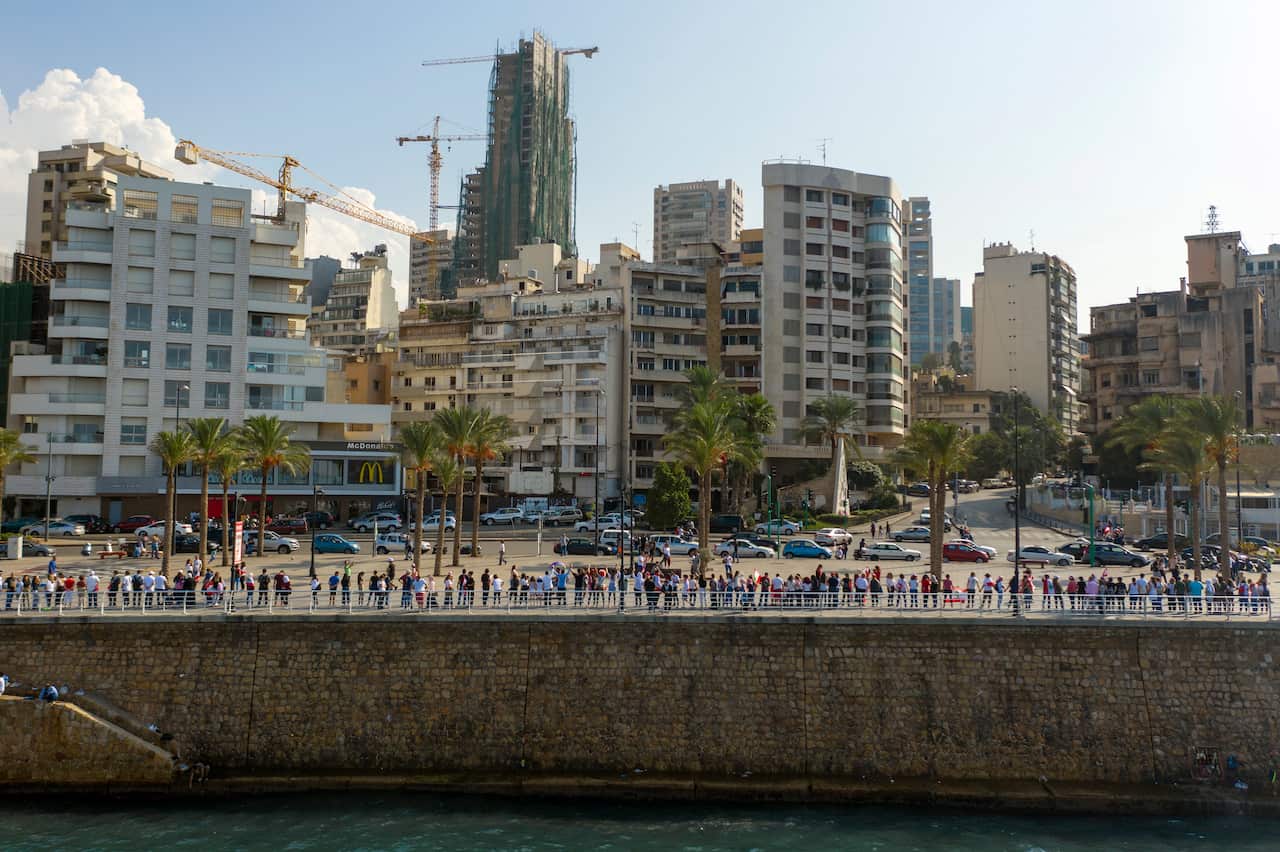 A picture taken with a drone shows an aerial view of Lebanese protesters forming a human chain.