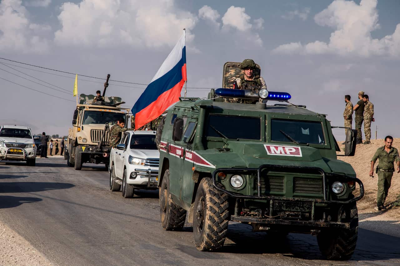 Kurdish forces withdraw from from an area near Turkish border with Syria, overseen by the Russian forces, near the town of Amuda, Sunday, Oct. 27, 2019.