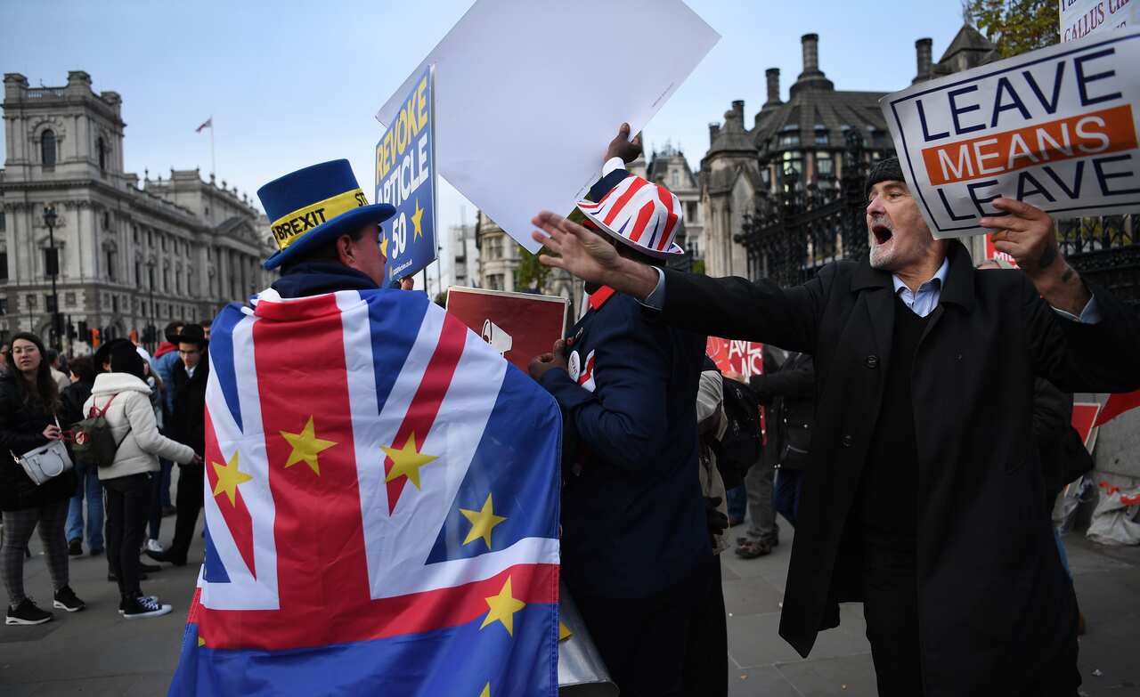 Pro-EU and pro-leave EU campaigners outside parliament in London.