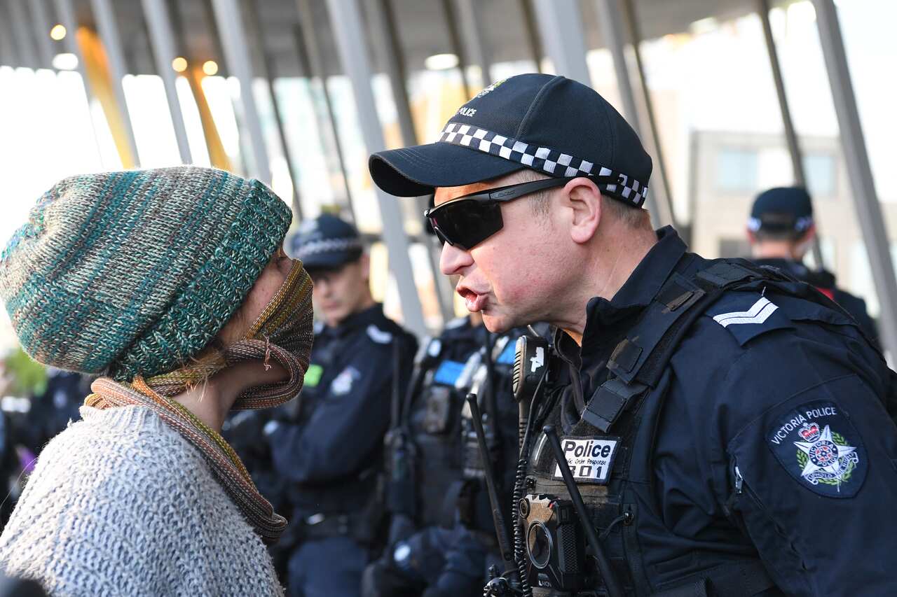 Environmental protesters clash with Police outside the Melbourne Exhibition and Convention Centre, Melbourne, Tuesday, October 29, 2019. 