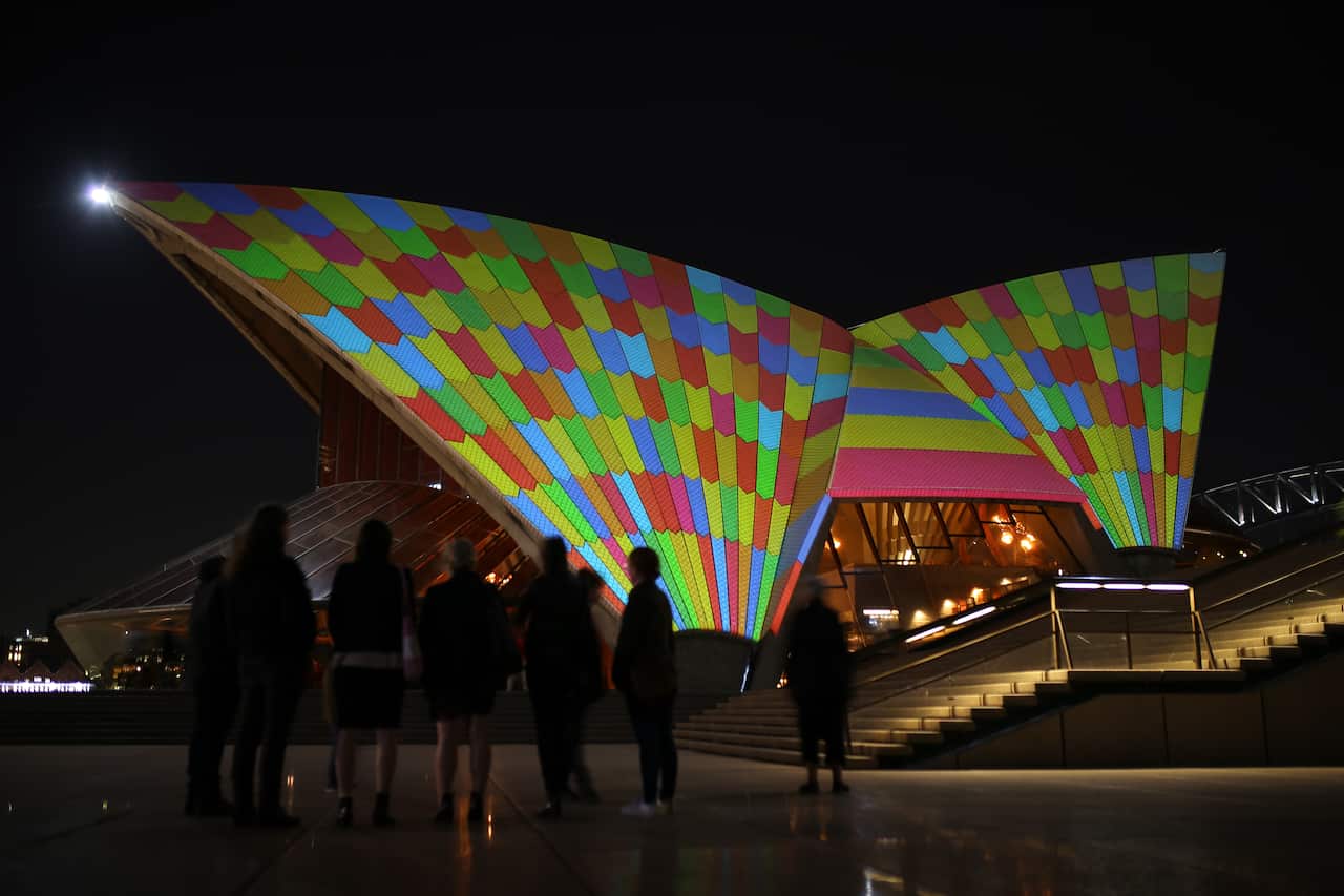 The eastern Bennelong sail of The Sydney Opera House is lit in the 17 colours of the United Nations Sustainable Development Goals in Sydney.