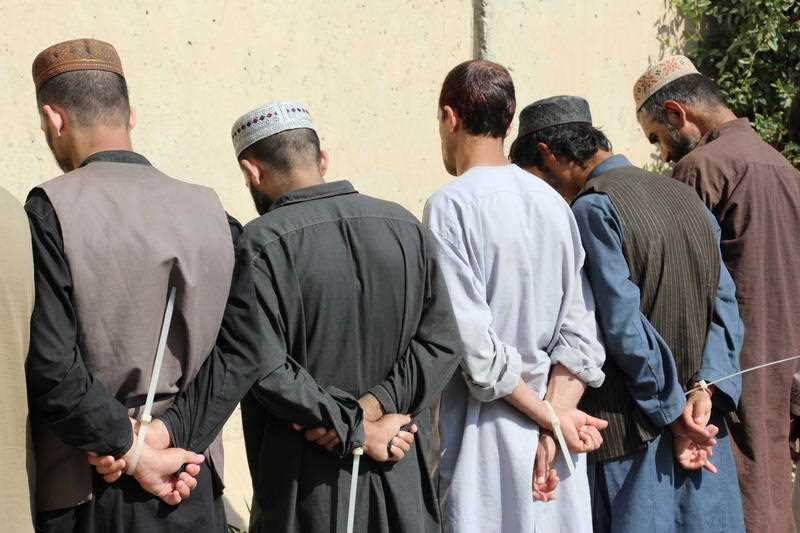 Afghan security officials present a group of suspected militants to the media during a news conference in Kandahar, Afghanistan, 30 October 2019