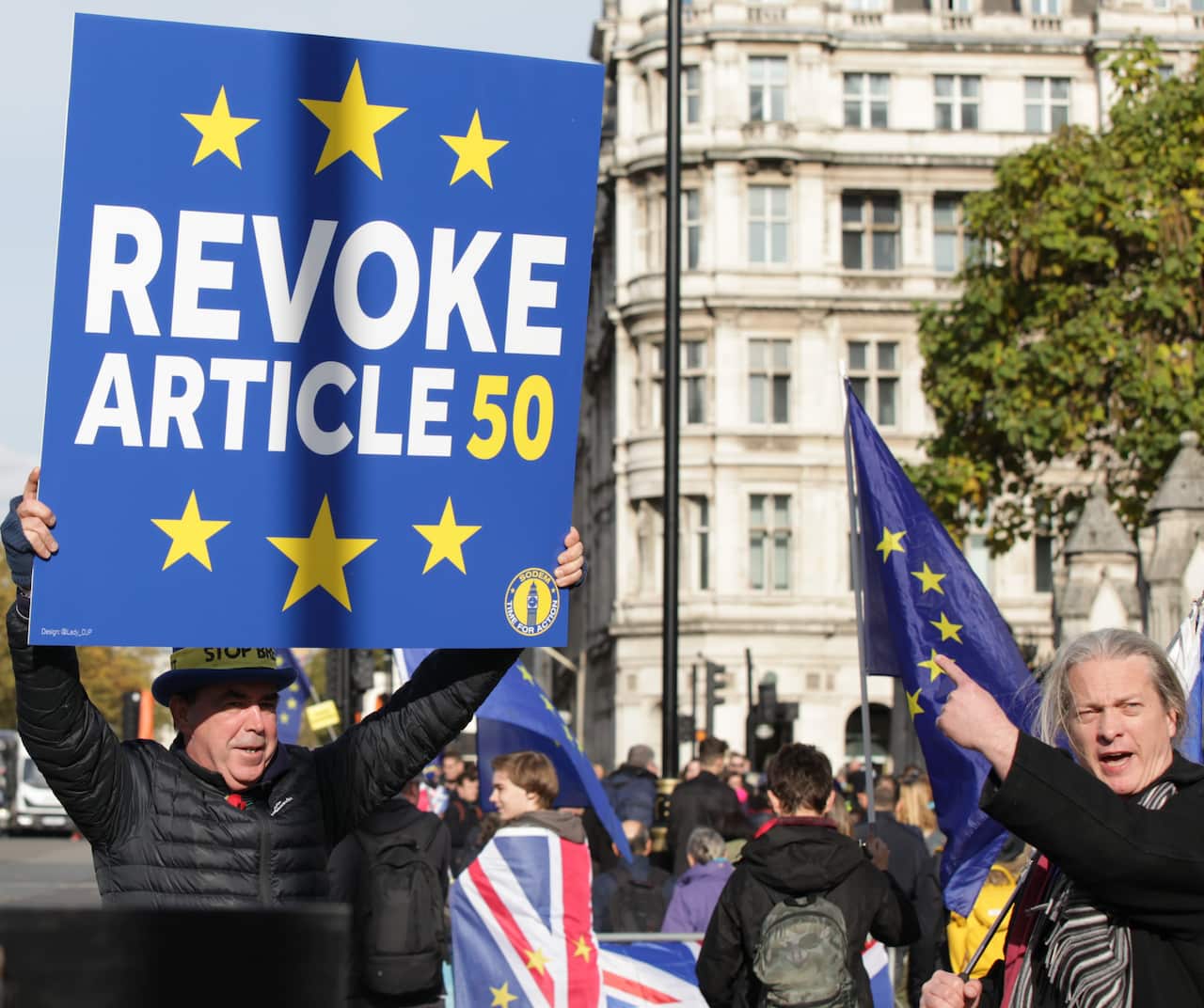 Campaigners outside the Houses of Parliament in London after Prime Minister Boris Johnson vowed to end the "dither and delay" over Brexit