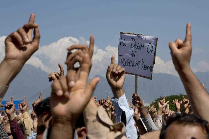 In this Aug. 23, 2019, file photo, Kashmiri men shout freedom slogans during a protest against New Delhi's tightened grip on the disputed region