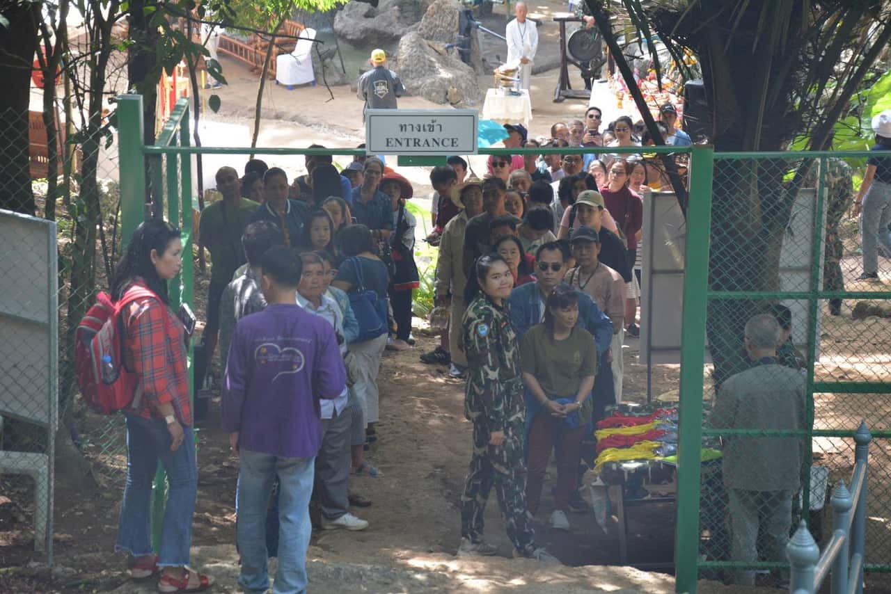 Crowds queue to enter the Tham Luang cave.