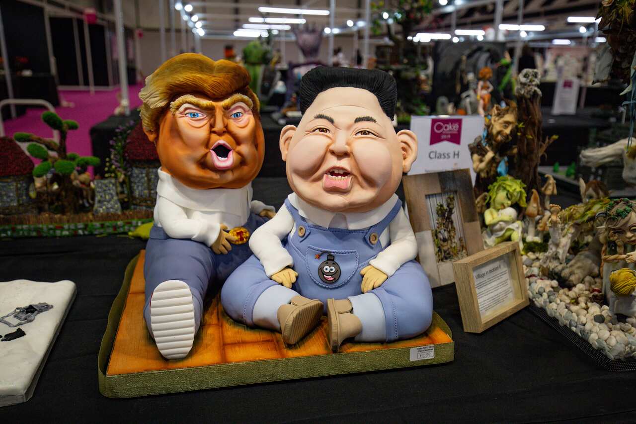 A cake depicting US President Donald Trump and North Korea leader Kim Jong-un on display during Cake International 2019.