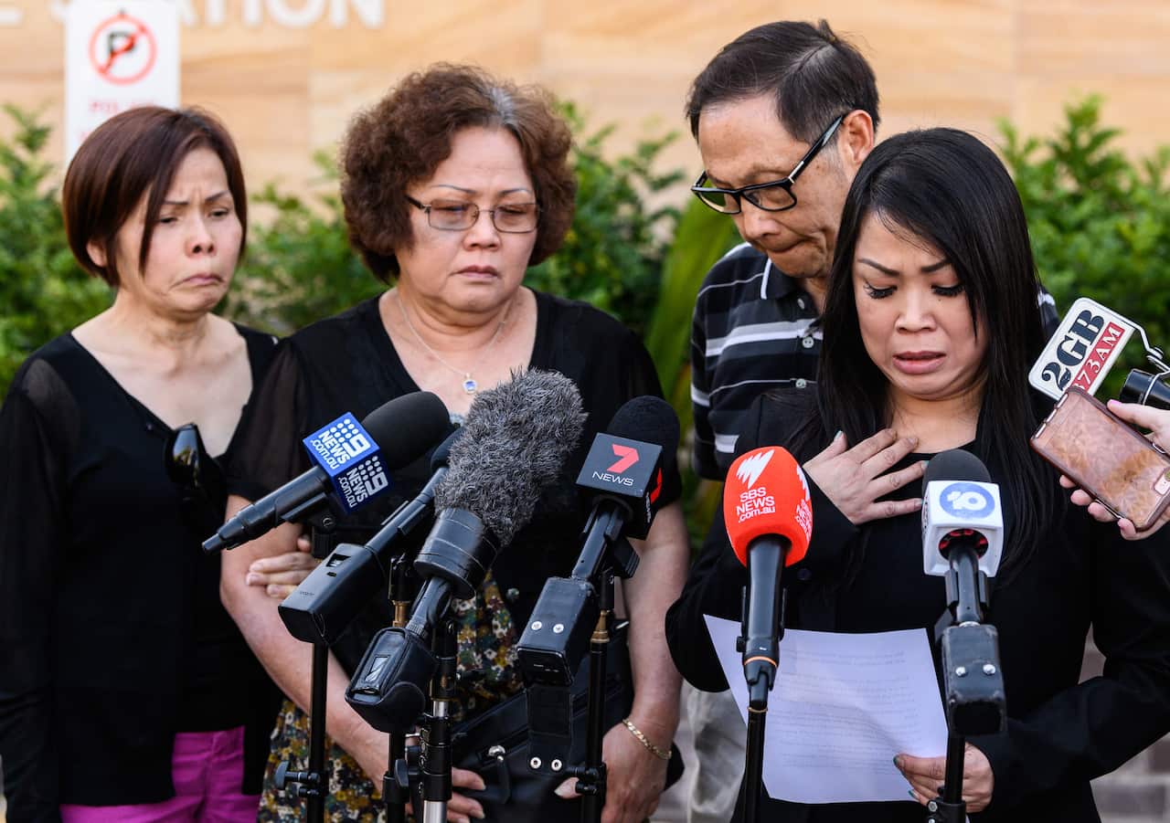 Family members watch on as Quanne Diec's cousin Christine Woo (right) reads a statement outside Granville Police Station, Sydney, Wednesday, 6 November, 2019.