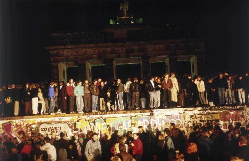 In this early morning, Nov. 10, 1989 file photo, Berliners from East and West crowd in front of the Brandenburger Tor (Brandenburg Gate).