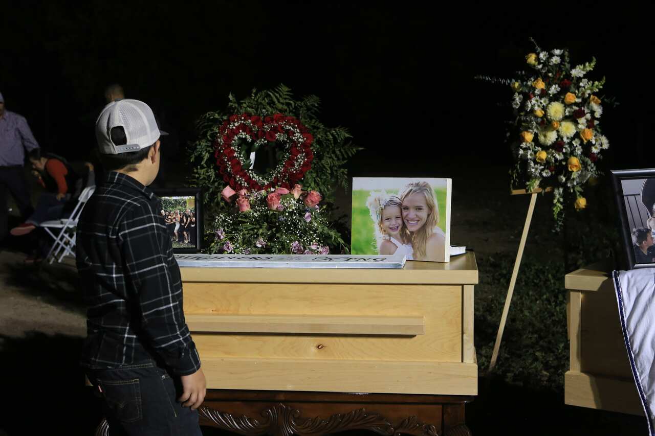 Family and friends mourn over  Rhonita, 30, one of the victims of the Mormon community, who were attacked by drug traffickers in the state of Sonora, Mexico.