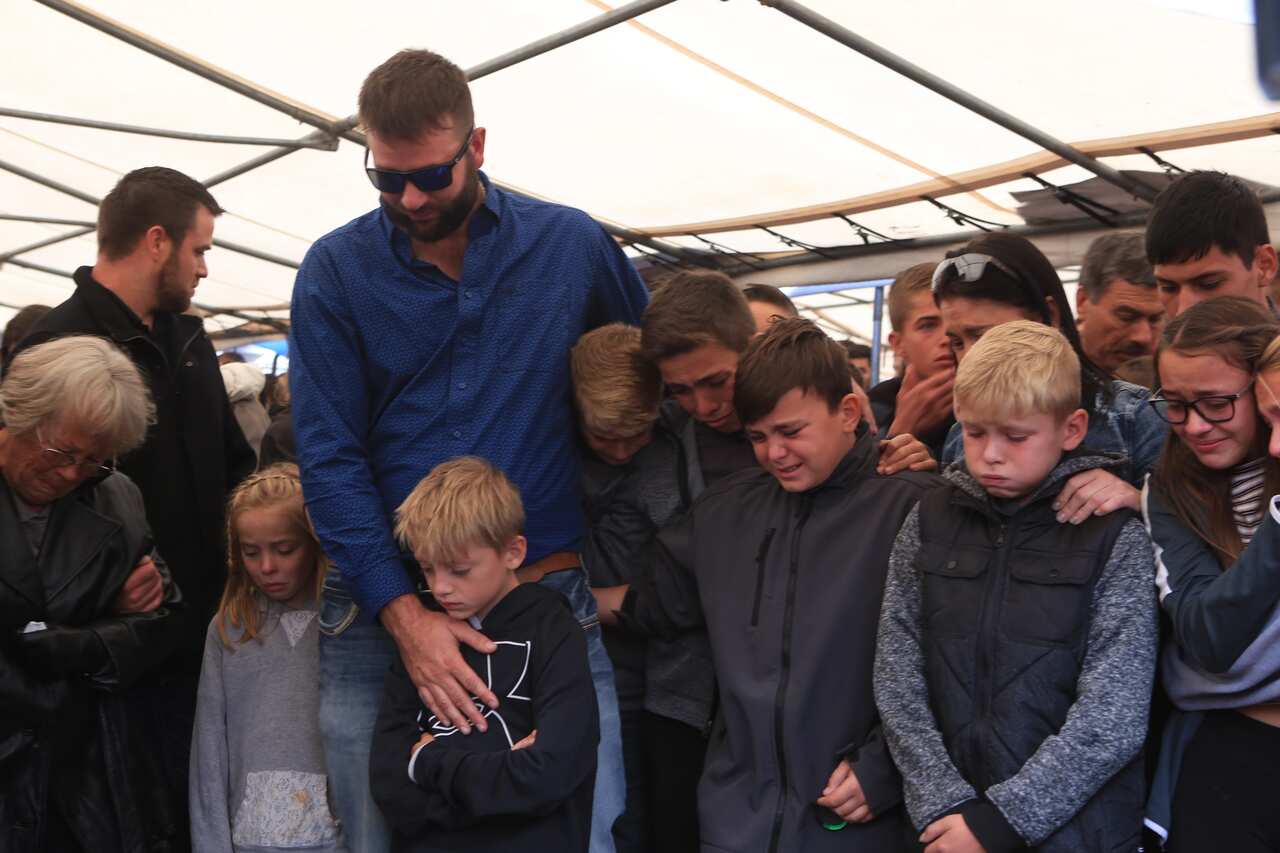 Relatives and friends attend the funeral of the LeBaron family in La Mora, Sonora, Mexico