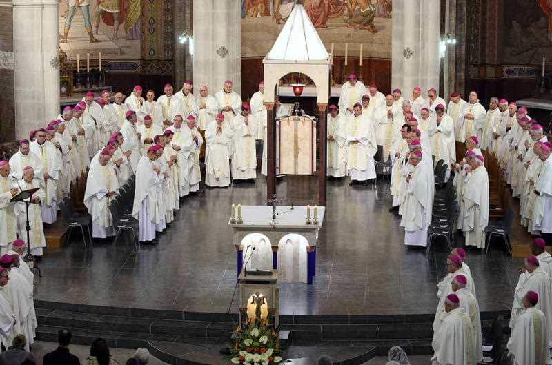 All of the bishops of France take mass in Notre-Dame Cathedral in Lourdes, southwestern France, Saturday, Nov. 9