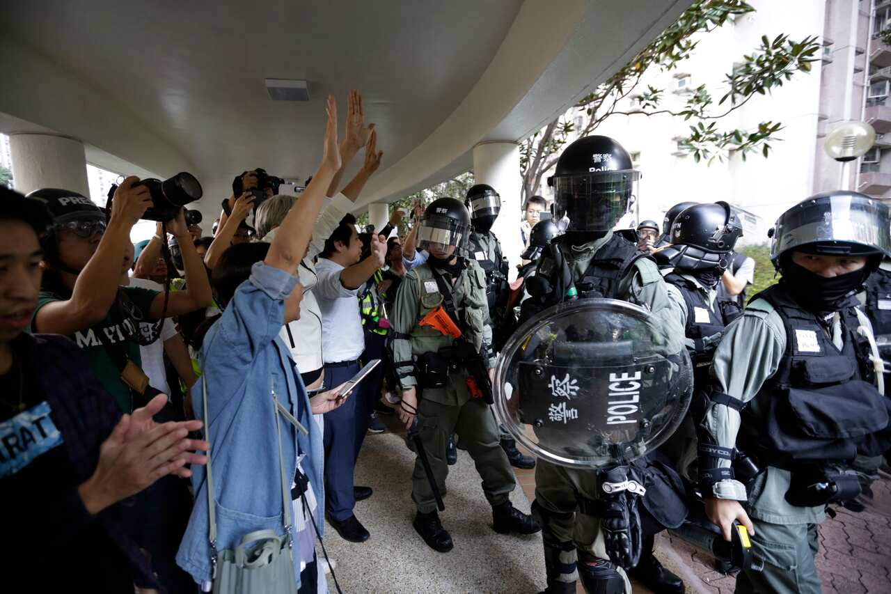 Authorities in Hong Kong have closed a subway station after protesters broke windows and damaged ticket machines.