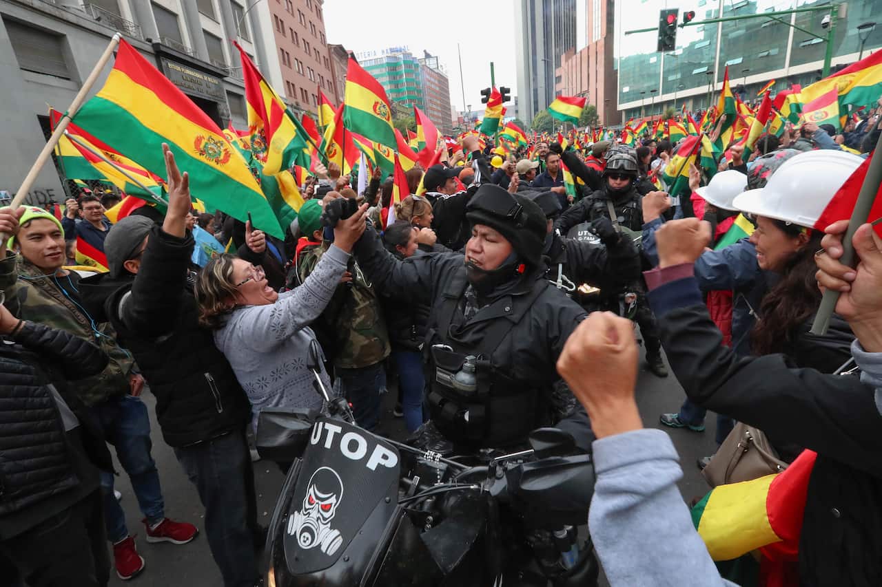 Bolivians celebrate the resignation of President Evo Morales, in La Paz, Bolivia, 10 November 2019.
