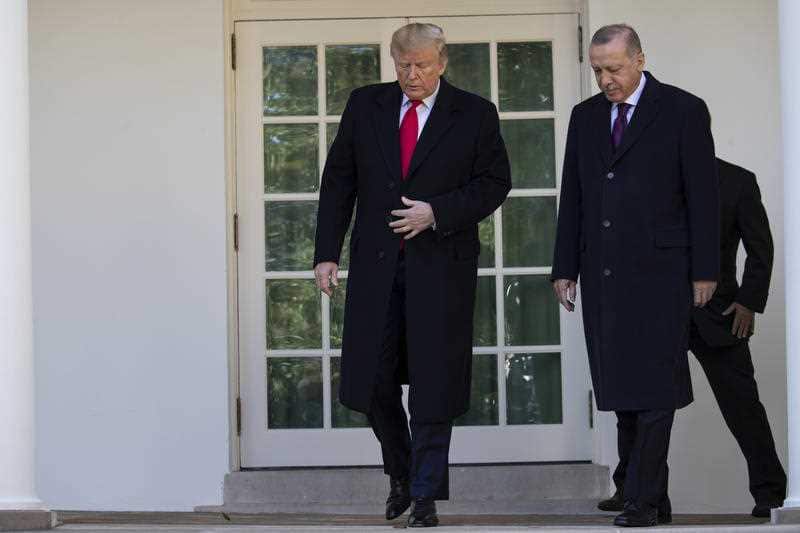 US President Donald Trump walks with Turkish President Recep Tayyip Erdogan to a meeting in the Oval Office