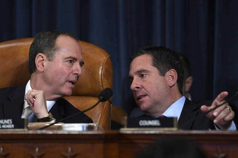 House Intelligence Committee Chairman Adam Schiff, left, talks with ranking member Devin Nunes, right.