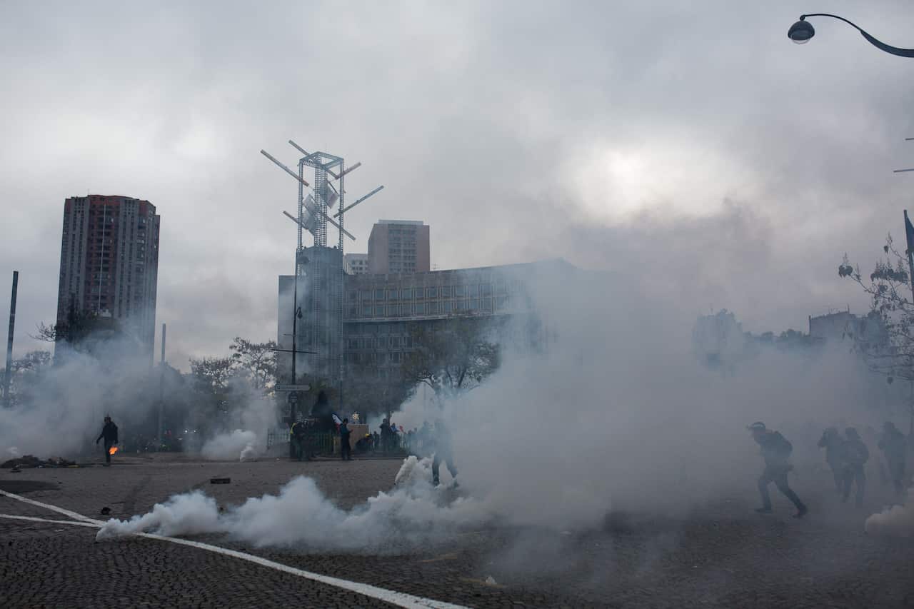 General view of the place d'Italie in Paris under tear gas.