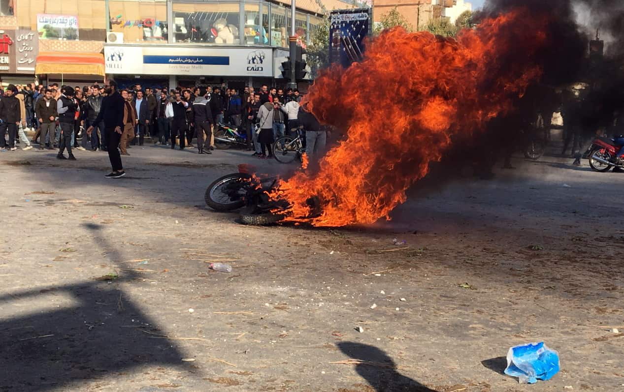 Iranian protesters clash in the streets.
