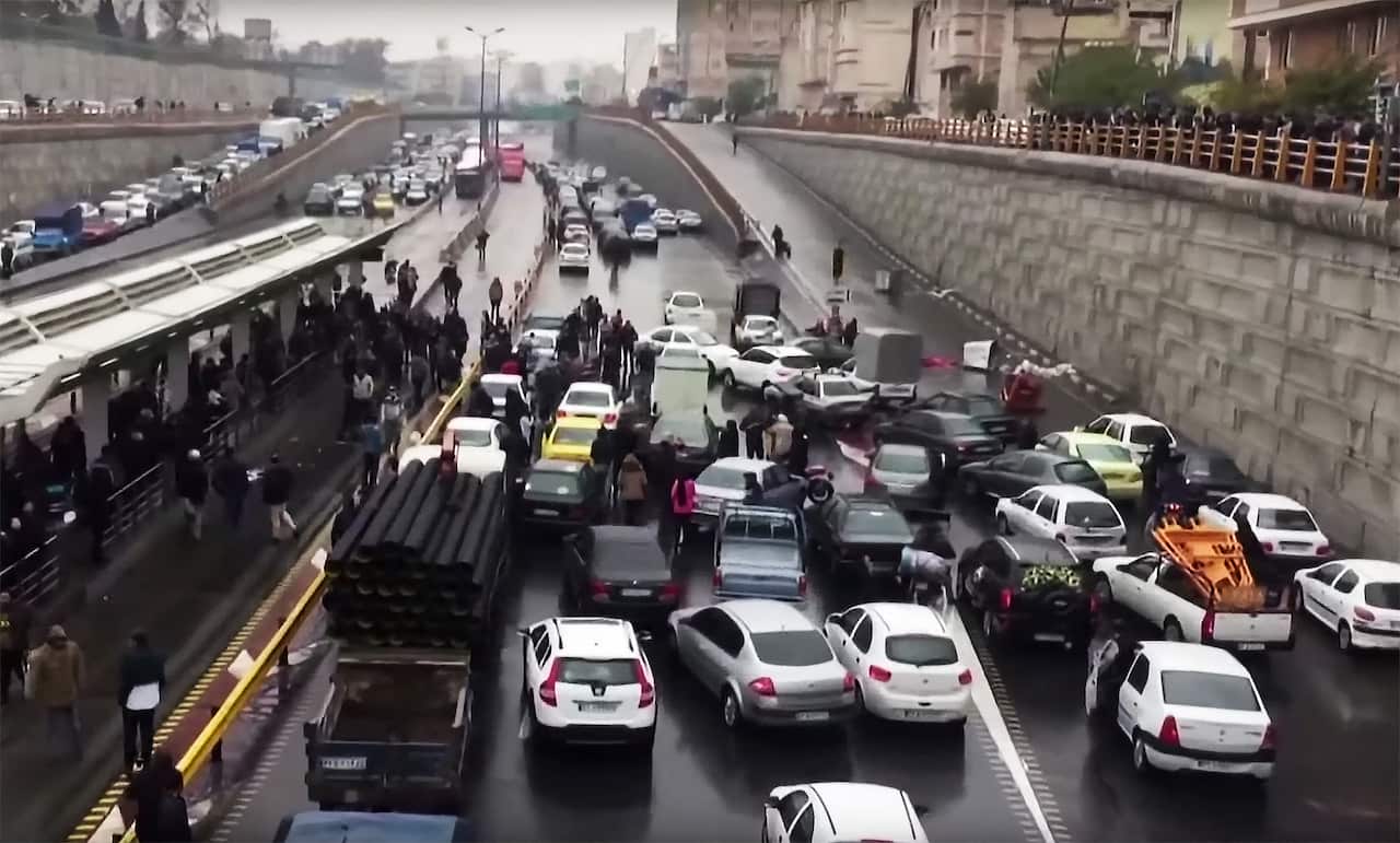 Iranian protesters block a road during a demonstration against an increase in fuel prices.