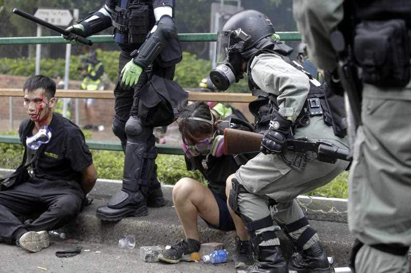 Riot police detain protesters near Hong Kong Polytechnic University in Hong Kong