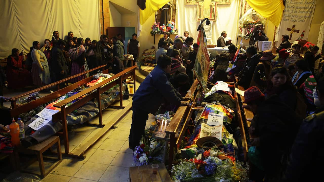 People attend a vigil to the victims of protests in a church in the city of El Alto, Bolivia.